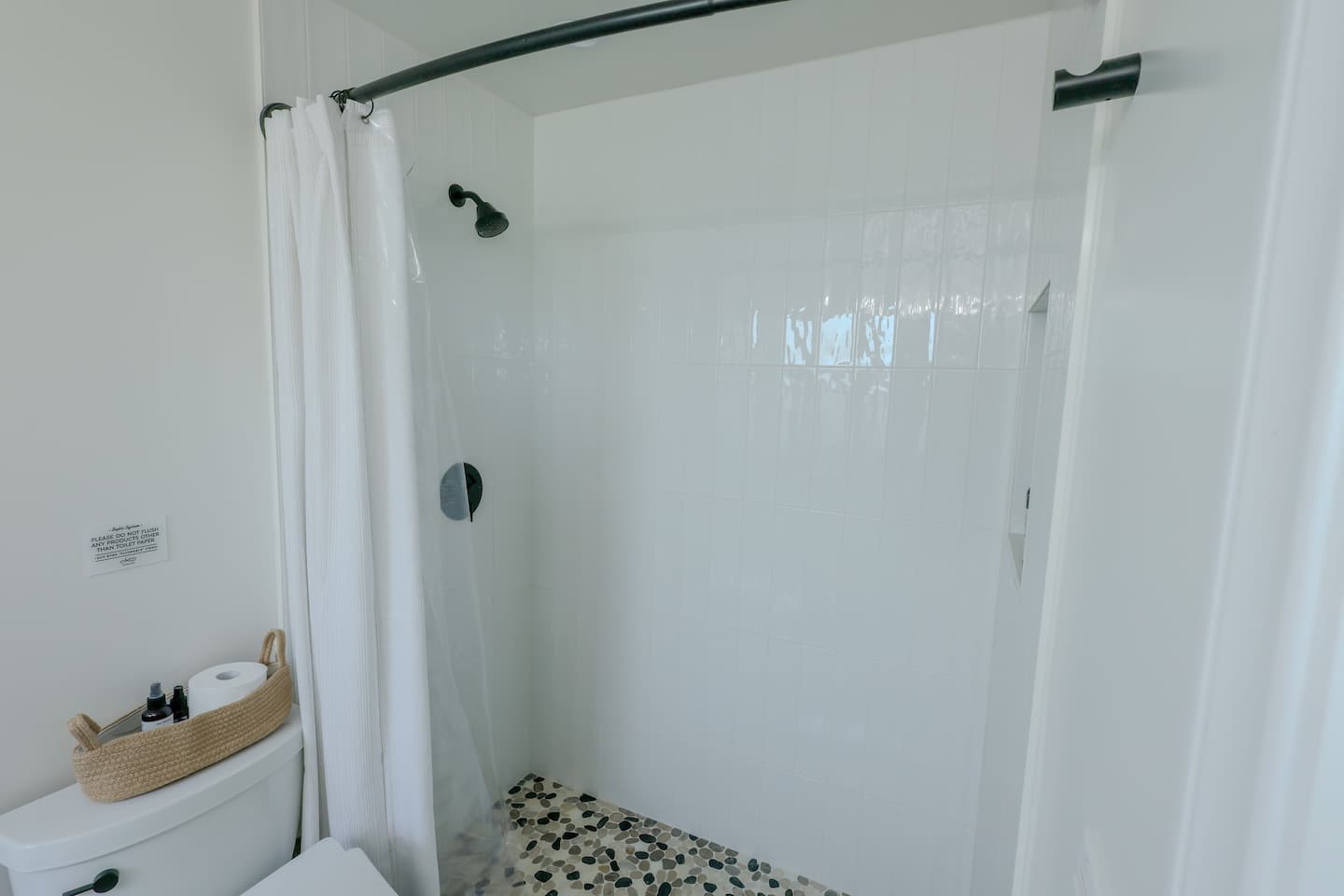 Second bathroom with a walk-in shower and bright coastal styling