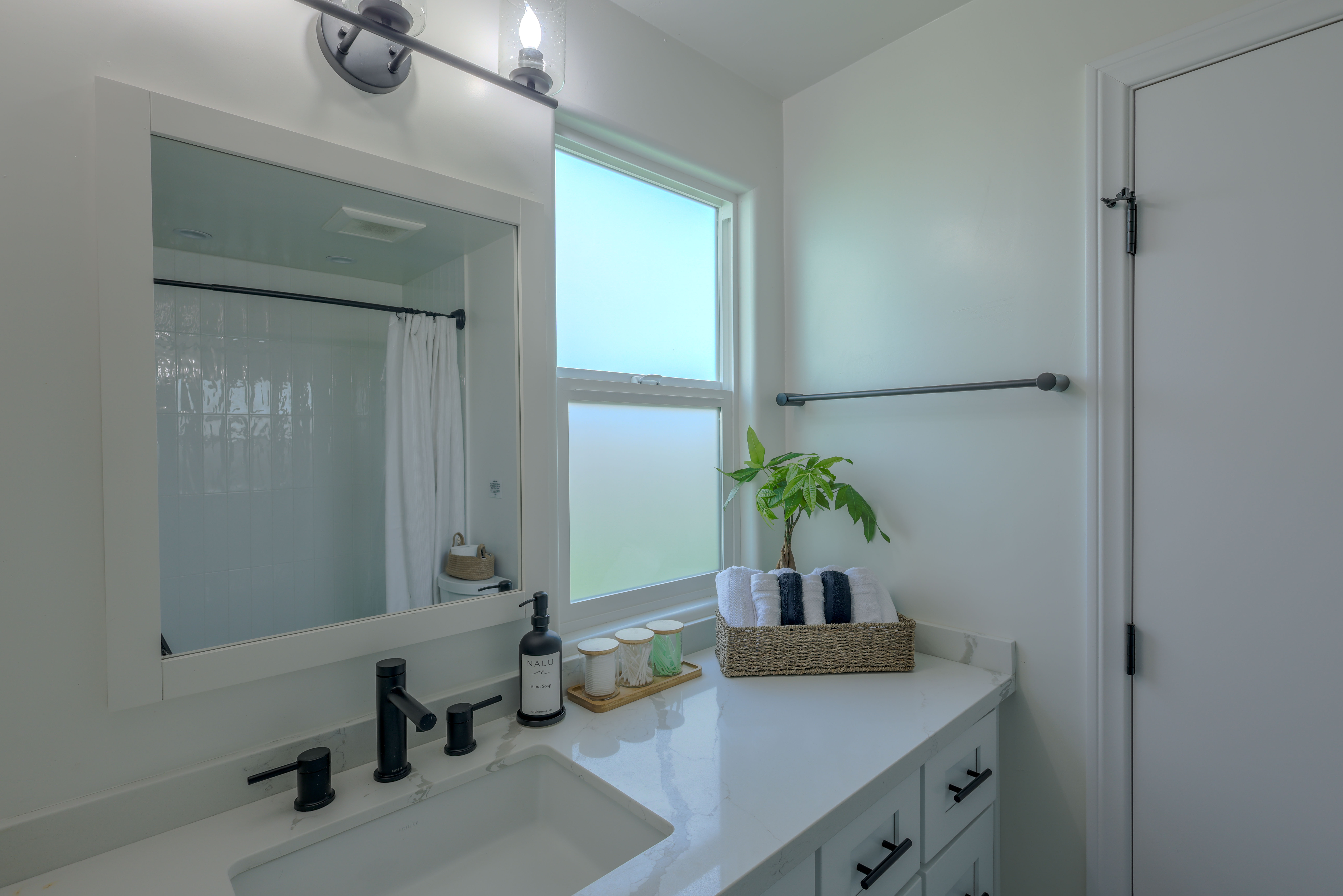 Second bathroom with bright, airy coastal styling