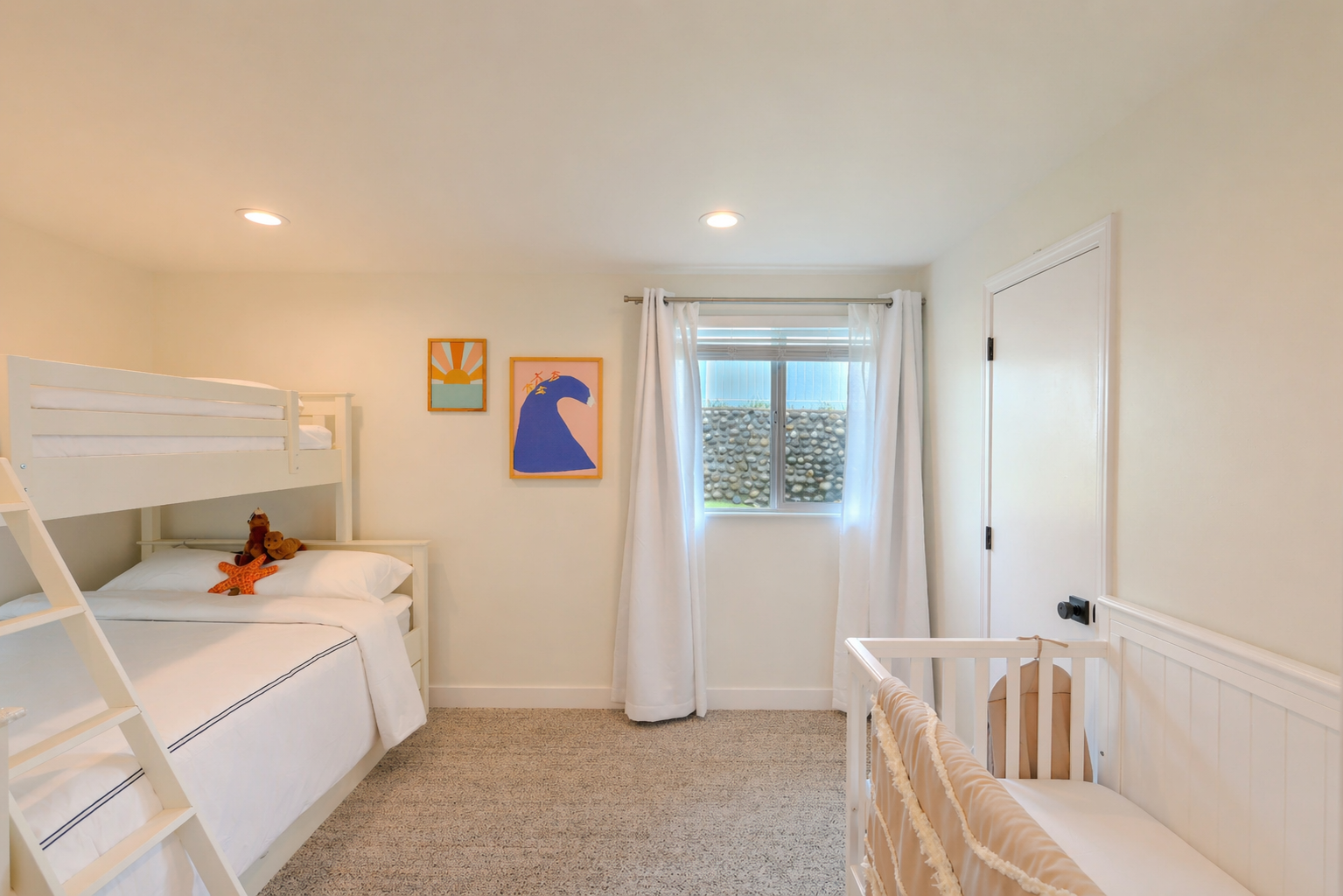 Another view of the family bunk room with playful coastal prints