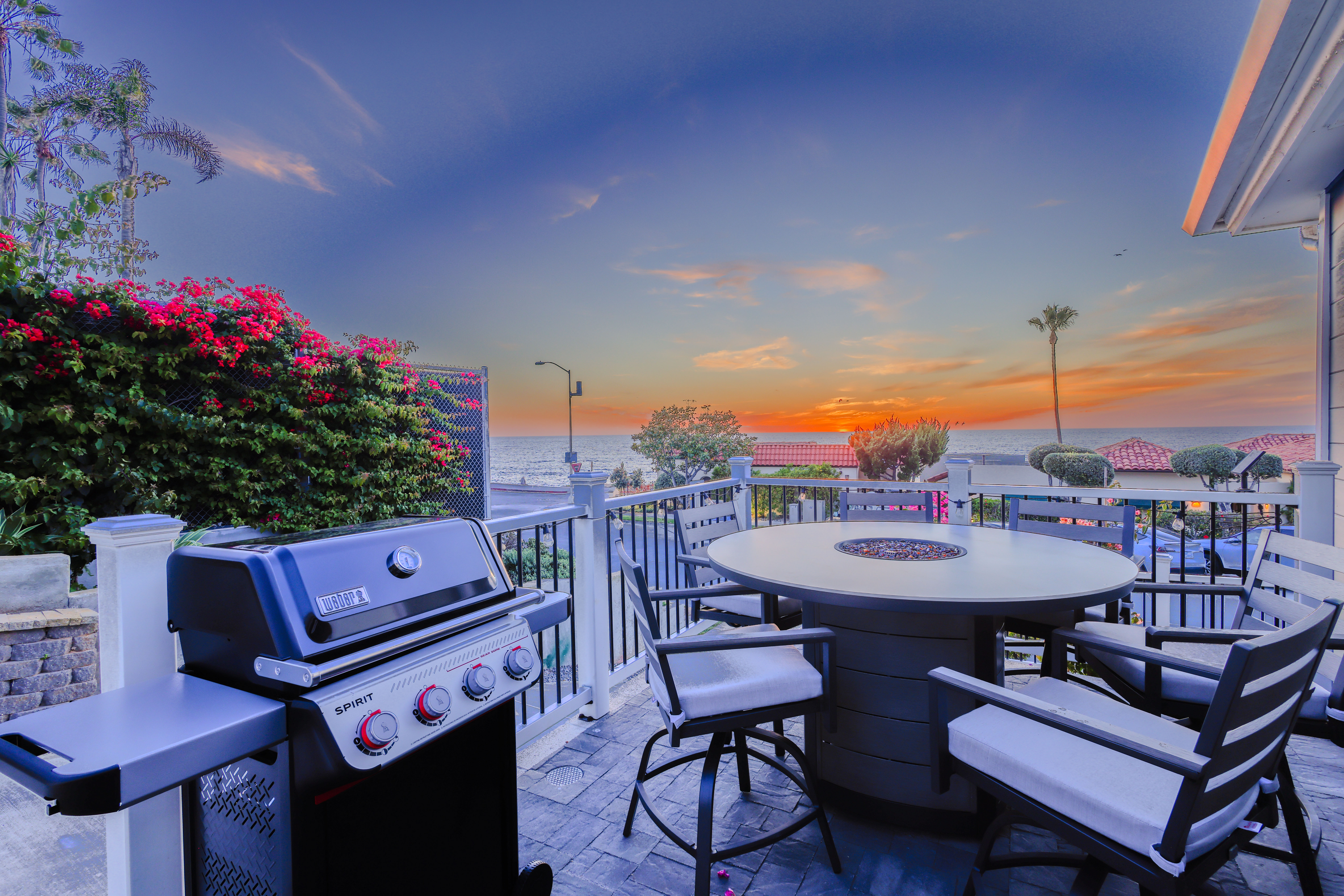 Ocean-view patio at Nalu House with a BBQ and firepit overlooking the Pacific