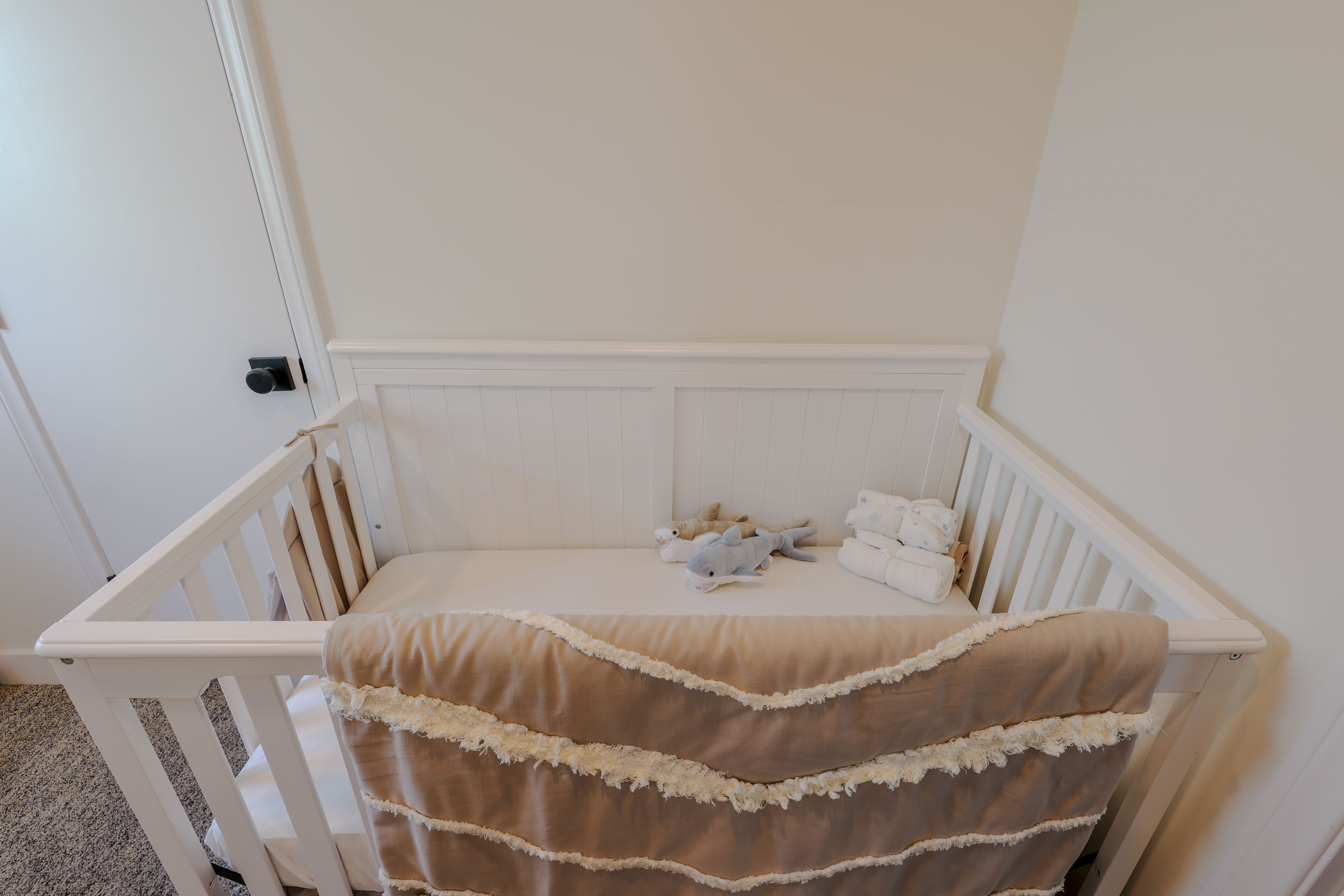 Family bedroom with a crib for the littlest guests